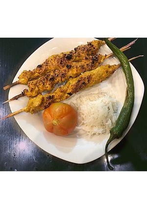 A picture of Chicken Kabab with Rice.