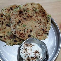 A picture of Palak Corn Paneer Paratha.