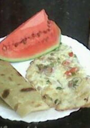 A picture of Kenyan Breakfast: Chapati, Omelette and Spiced Kenyan Black Tea.