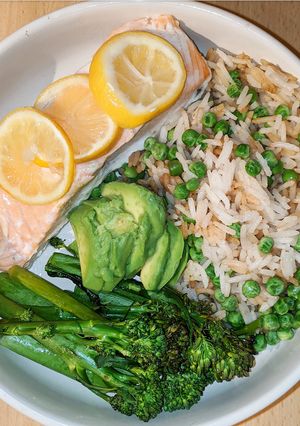 A picture of Lemon salmon with rice and tenderstem broccoli.