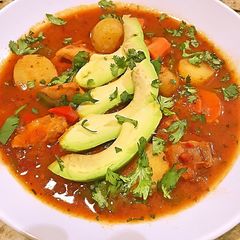A picture of Chicken and potato adobo soup.