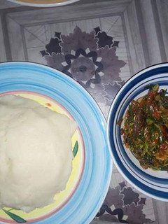A picture of Waterleaf soup with poundo.