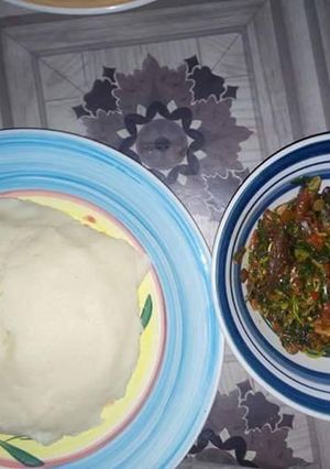 A picture of Waterleaf soup with poundo.
