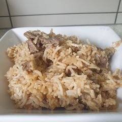 A picture of Beef stroganoff with rice.