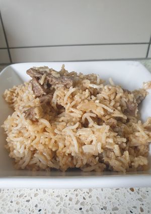 A picture of Beef stroganoff with rice.