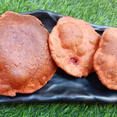 Leftover beetroot carrot tomato pulp poori A picture of Leftover beetroot carrot tomato pulp poori.