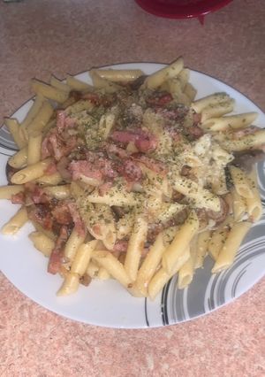 Una foto de Macarrones con setas y bacon