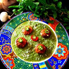 A picture of Baked stuffed Mushrooms in Mint Gravy.