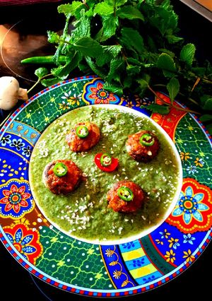 A picture of Baked stuffed Mushrooms in Mint Gravy.