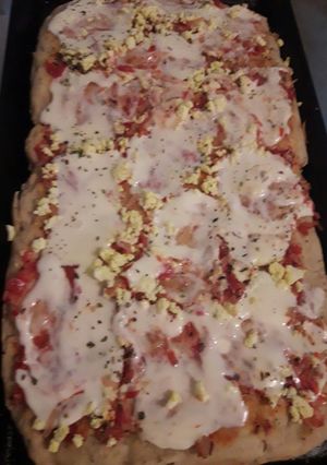 Una foto de Pizza con harina leudante en bifera