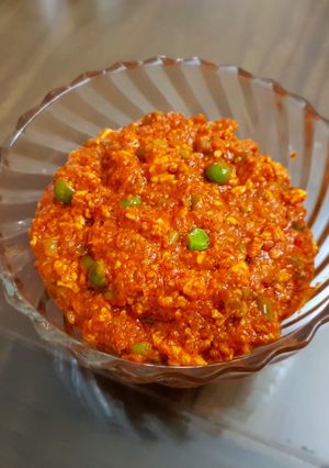 A picture of Paneer bhurji with capsicum and peas.