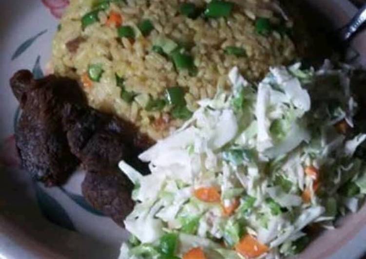 Coconut rice and fried meat and salad