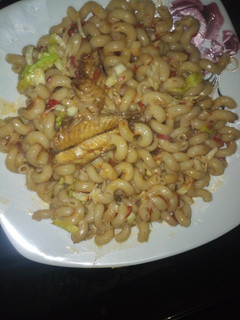 A picture of Macaroni jallof with scarcy cavage.