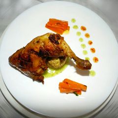 Poulet Confit,Jacket Potato,Glazed Carrot served withMango Sauce A picture of Poulet Confit,Jacket Potato,Glazed Carrot served withMango Sauce.