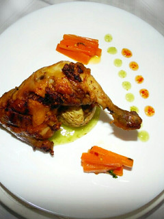 A picture of Poulet Confit,Jacket Potato,Glazed Carrot served withMango Sauce.