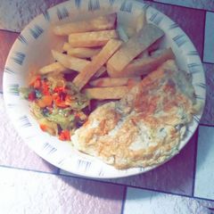 A picture of Fried yam and egg with cabbage sauce.