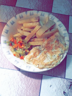 A picture of Fried yam and egg with cabbage sauce.