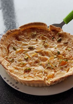 Une photo de °tarte au flan et pêches °