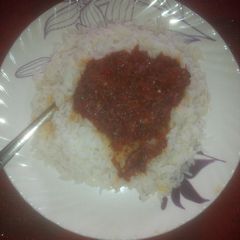 A picture of White rice with stew.