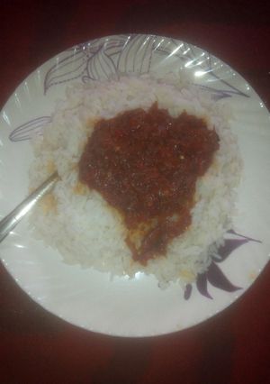 A picture of White rice with stew.