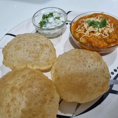 Chole Puri and onion raita A picture of Chole Puri and onion raita.