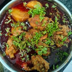 Bengali Style Murgi Laal Jhol (Red Chicken Curry) A picture of Bengali Style Murgi Laal Jhol (Red Chicken Curry).