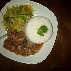 A picture of Rice, beef and cabbage.