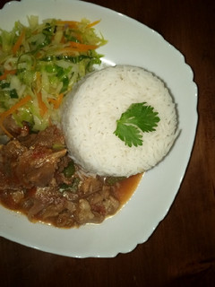 A picture of Rice, beef and cabbage.