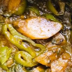 A picture of Stir fried Aloo palak capsicum.
