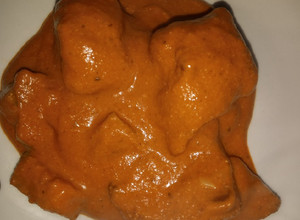 Una foto de Pipián rojo con carne de puerco y chilacayote