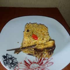 A picture of Local Jollof rice with dry fish.