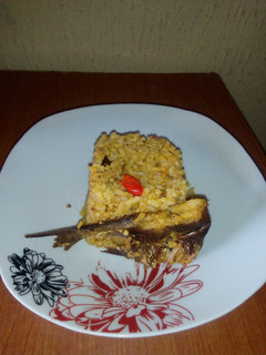 A picture of Local Jollof rice with dry fish.