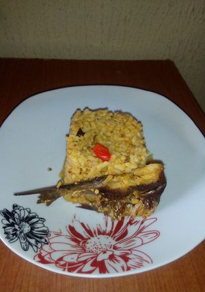 A picture of Local Jollof rice with dry fish.