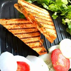 A picture of Pan Grilled potato mint chutney sandwich.