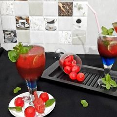 A picture of Watermelon Mojito with blue Curacao.