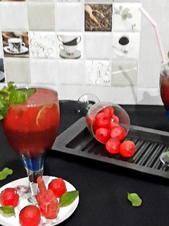A picture of Watermelon Mojito with blue Curacao.