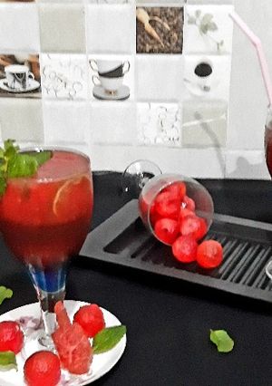 A picture of Watermelon Mojito with blue Curacao.