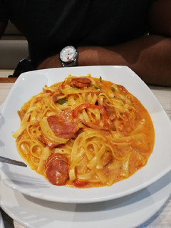 A picture of Spicy bacon/sausage fettuccine.