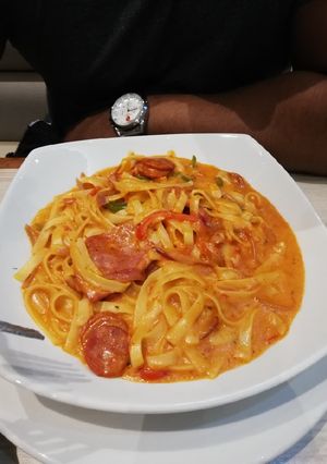 A picture of Spicy bacon/sausage fettuccine.