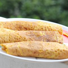 A picture of Moong Dal chilla with roasted Spinach filling.