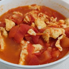 A picture of Tomato with Fried Egg.