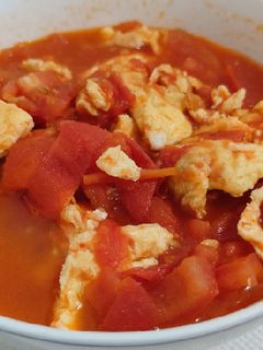 A picture of Tomato with Fried Egg.