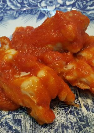 Una foto de Patitas de cordero con tomate