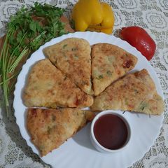 A picture of Bell Pepper & Flour Triangle Fritters.