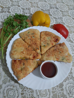 A picture of Bell Pepper & Flour Triangle Fritters.