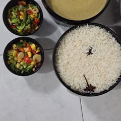 A picture of Rice withThai curry with veggies.