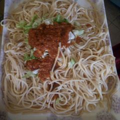 A picture of Plain spaghetti and stew.