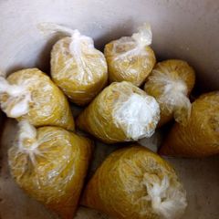 A picture of Oil palm moi moi (cooked ground beans meal).