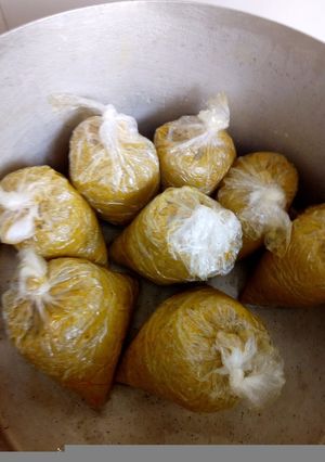 A picture of Oil palm moi moi (cooked ground beans meal).