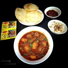 A picture of Bengali Aloor Dum with luchi.